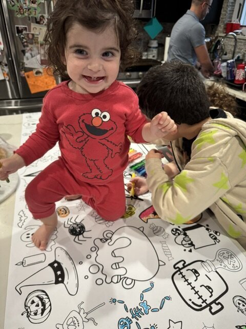 2 little kids coloring halloween banner
