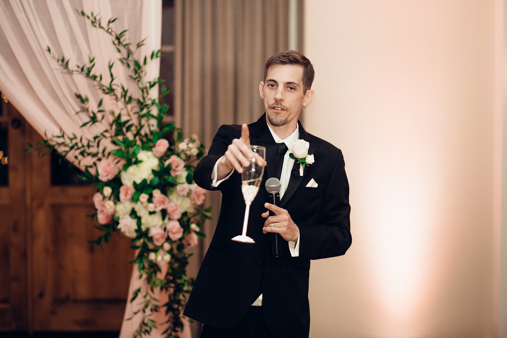 Wedding Photograph Of Groom In Black Suit Proposing a Toast  Los Angeles