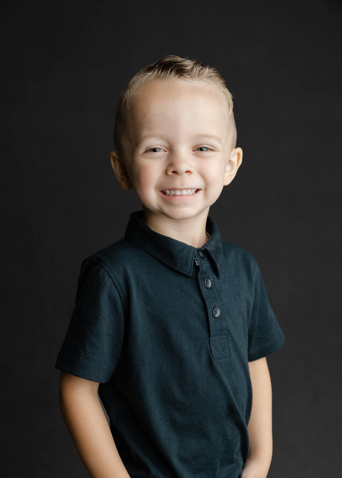 Preschool Aged boy smiling for his school picture  by las vegas school photographer, Jessica Bowles