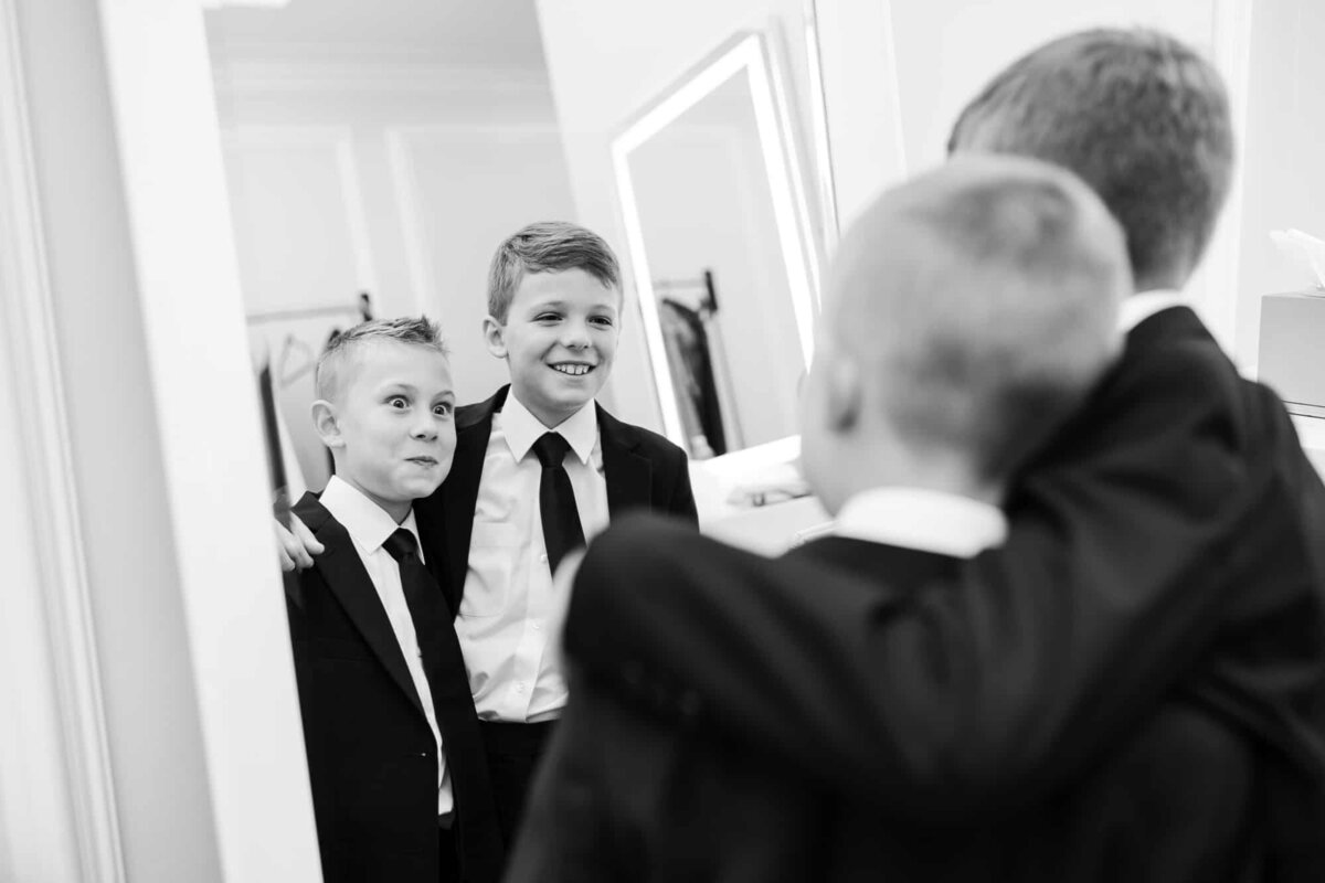 Junior groomsmen being excited for the wedding photographed by Palm Beach wedding Photographers