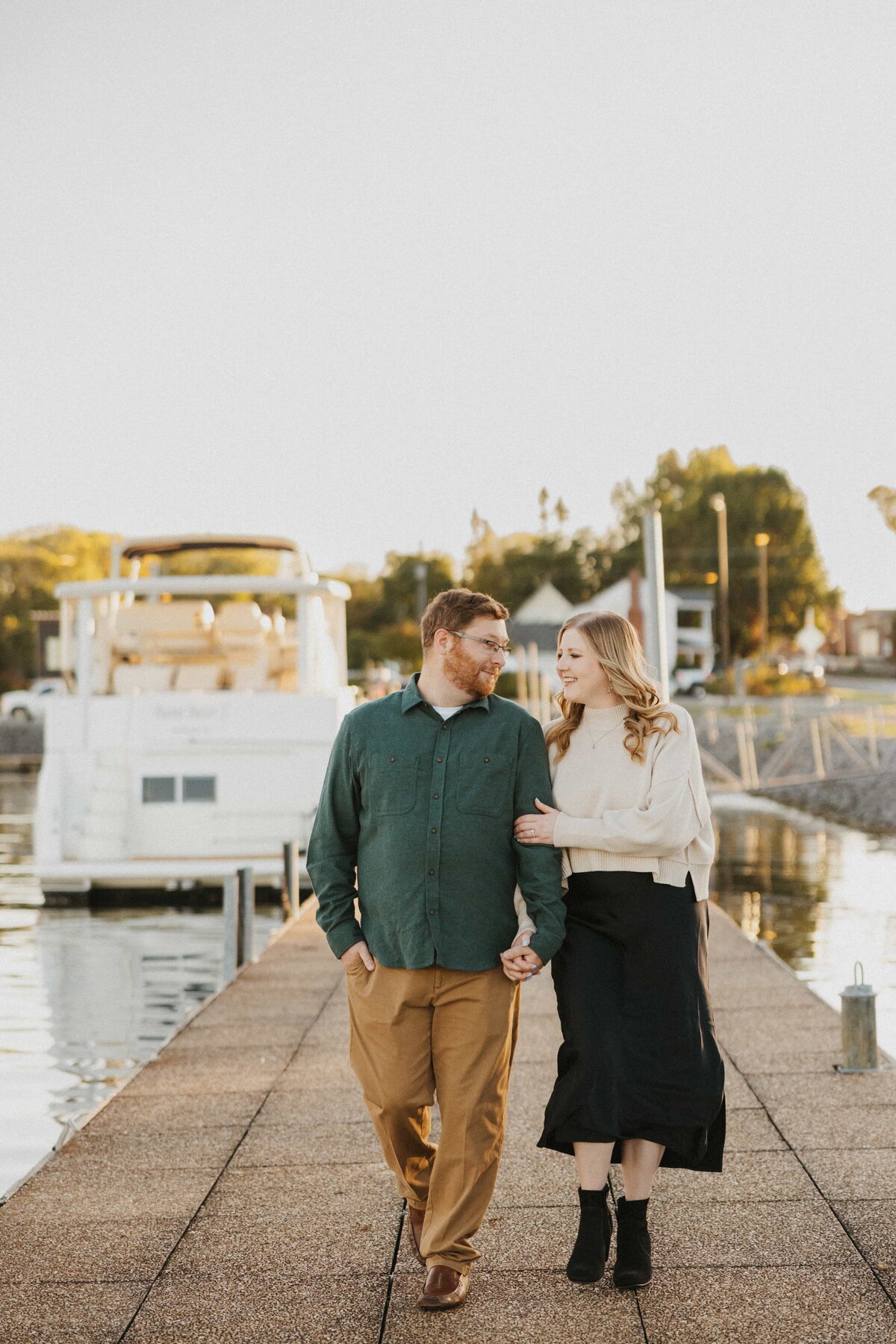 couple holding hands walking