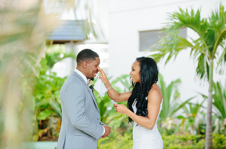 bride and groom seeing each other before wedding, groom is crying