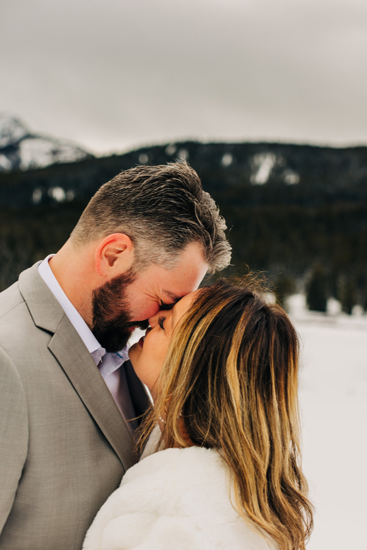 Embrace the enchantment of a winter mountain elopement with our captivating photography services. Amidst snow-kissed peaks and crisp alpine air, we specialize in capturing the intimacy and magic of your special day. From exchanging vows against a backdrop of majestic landscapes to stealing quiet moments in serene snow-covered settings, our expert photographers ensure every detail is preserved for a lifetime of cherished memories. Let us turn your winter mountain elopement dreams into stunning photographic reality. Explore our portfolio and embark on a journey of love and adventure in the heart of winter's wonderland