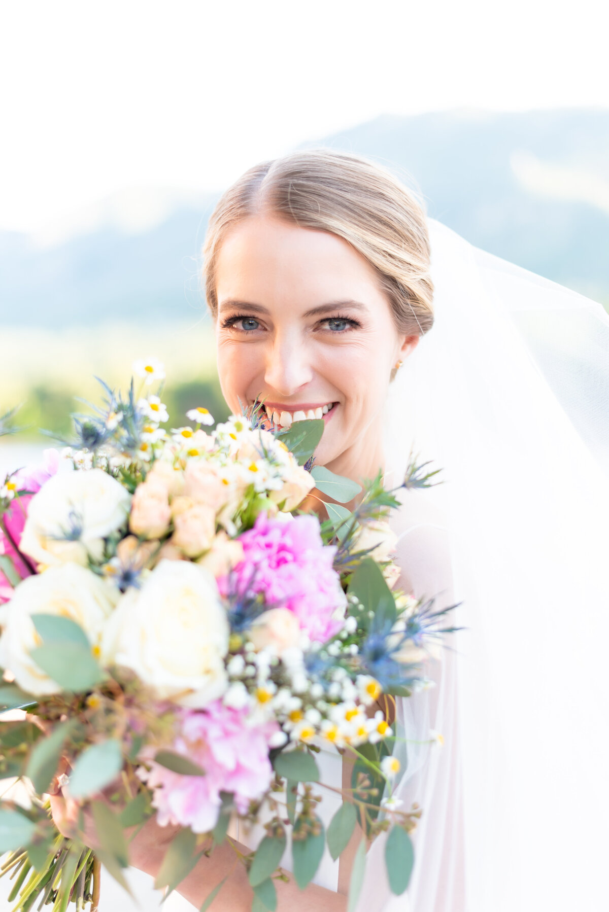 Bride holding her flower bouquet on her wedding day in Colorado