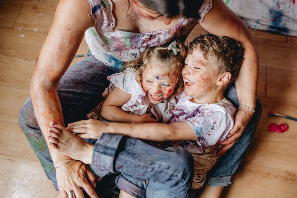 In-home family photo session with paint