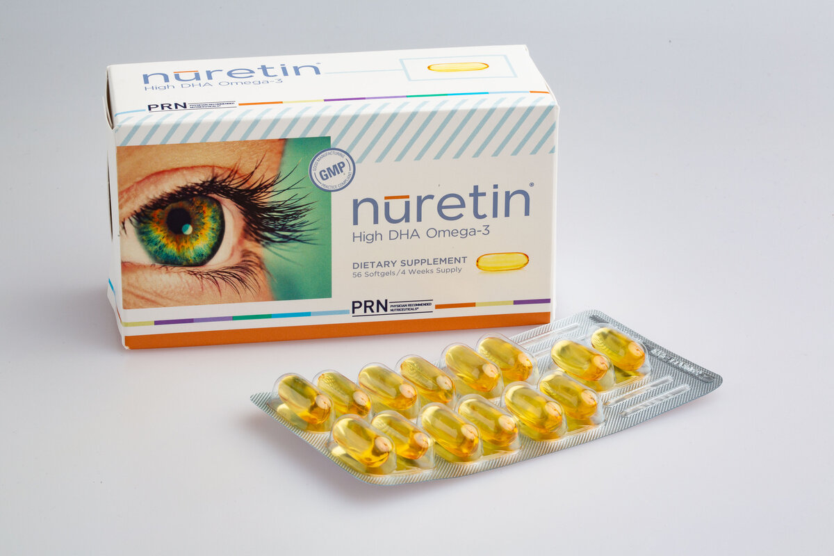 Gold vitamins in vitamin pack with box featuring an eye behind them