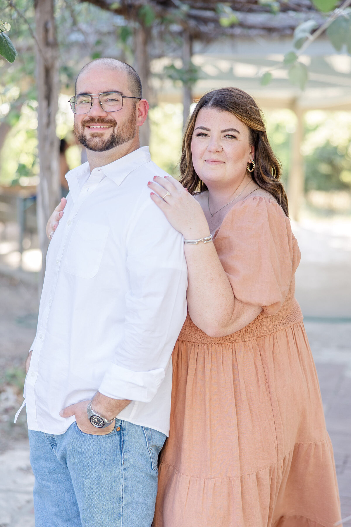 Boerne Texas wedding engagement session with peach dress by Firefly Photography