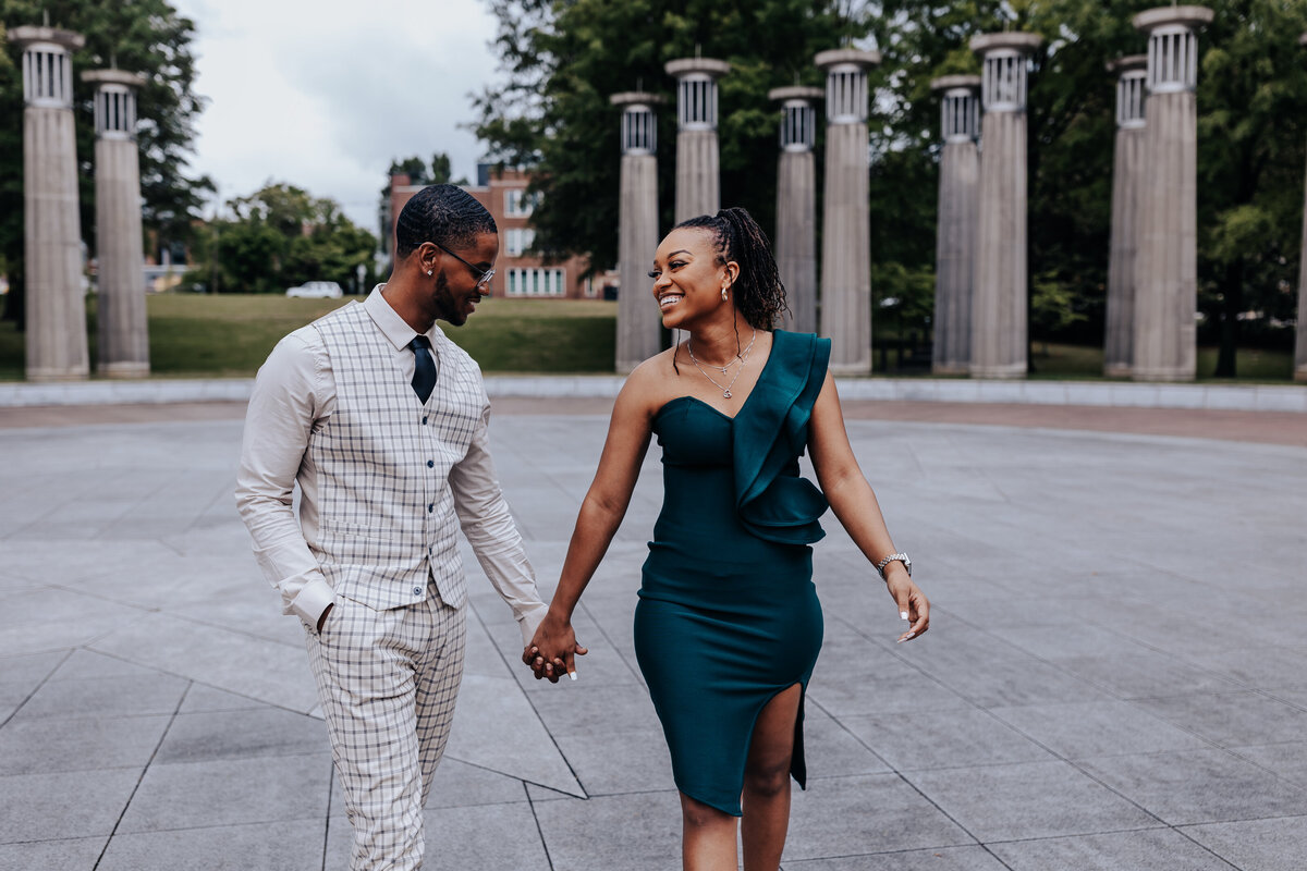 Nashville engagement photographer captures newly engaged couple walking hand in hand