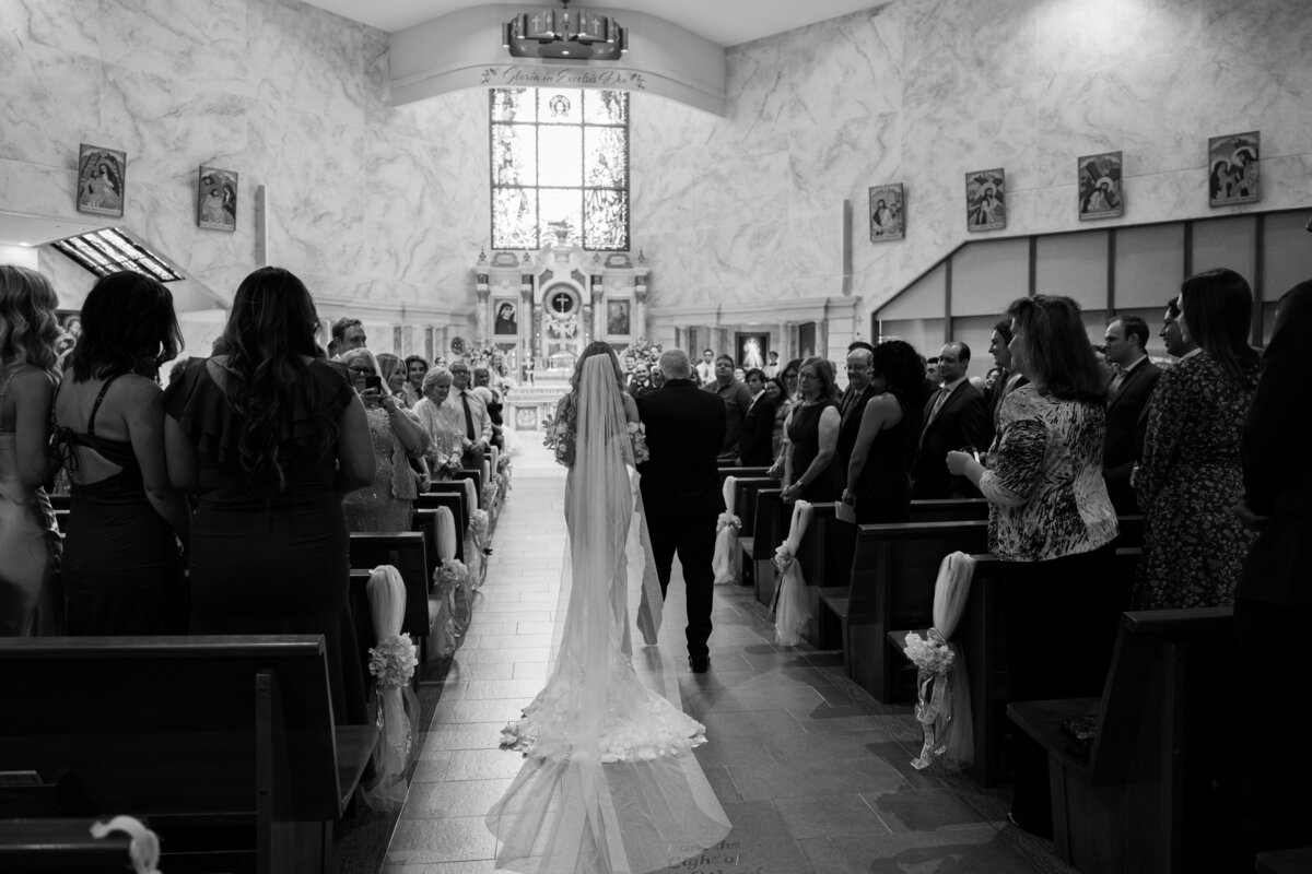 bride walking down the aisle at church wedding in Southern California