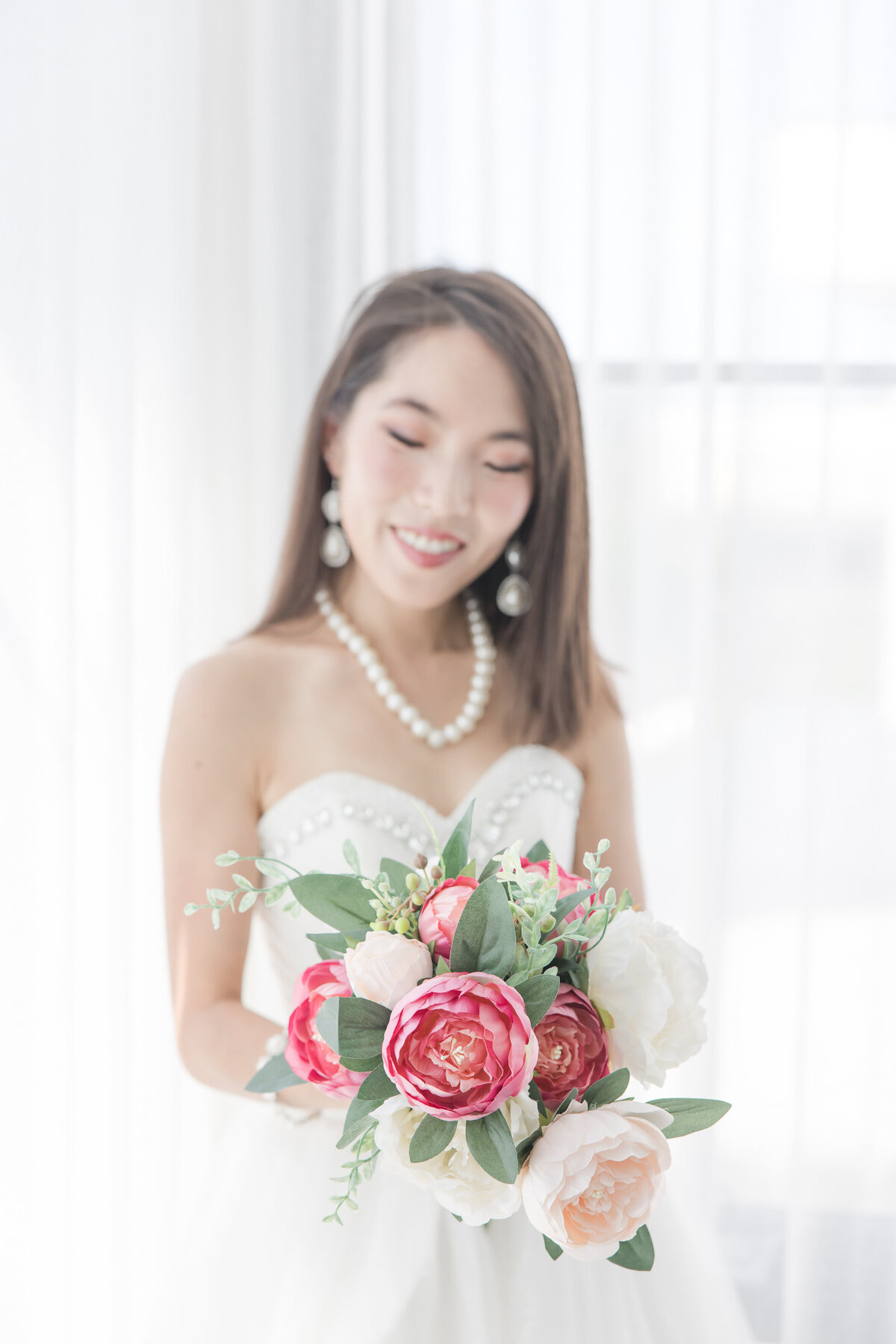 bridal bouquet with bride out of focus