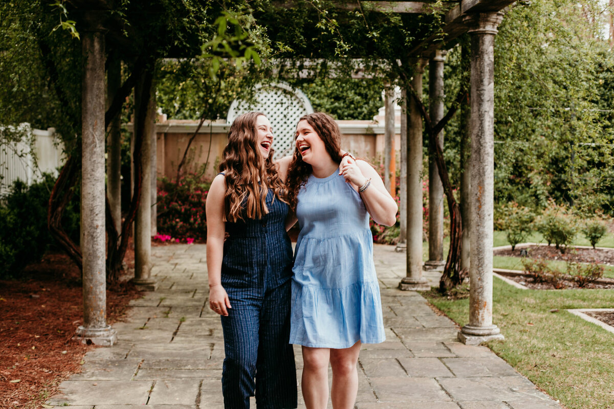 lesbian couple walk during engagement session