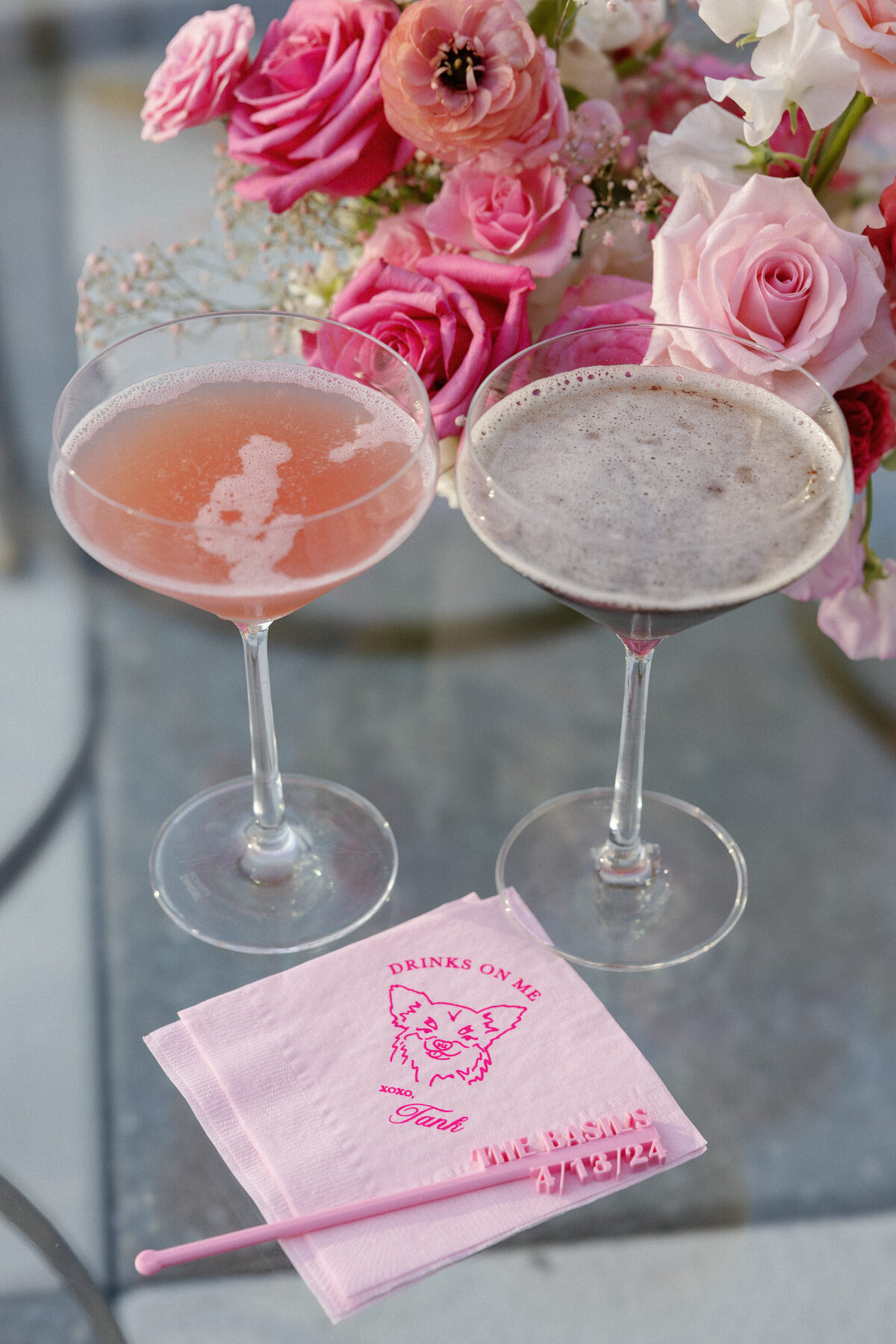 two cocktails with pink napkin