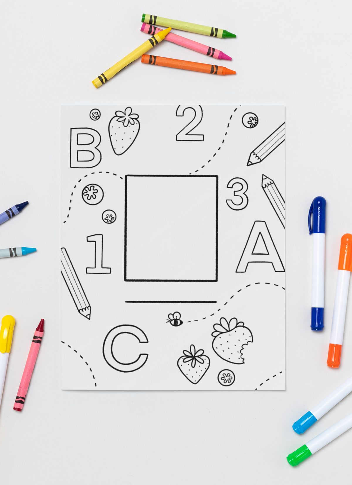 mockup-featuring-a-coloring-book-surrounded-by-crayons-and-markers-30944