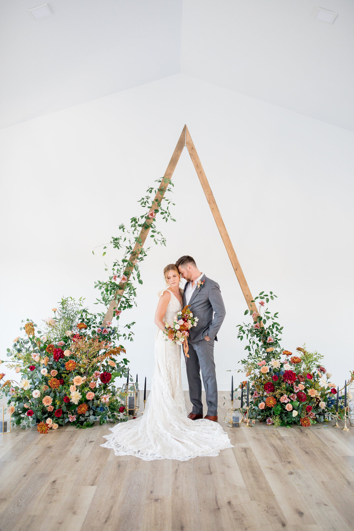 boho triangle wedding arch, studio fleurette, pinewood wedding, mn florist