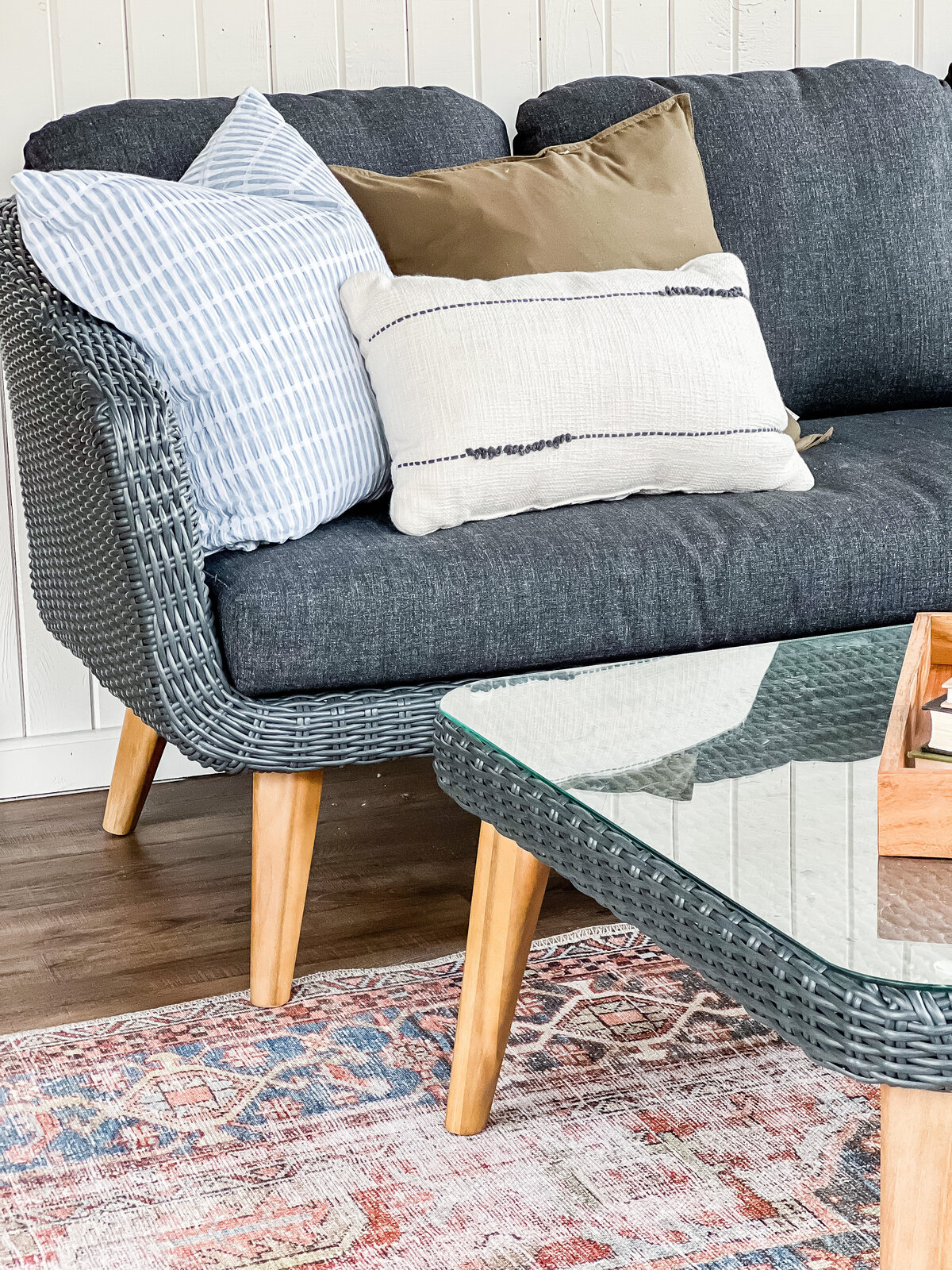 A brightly lit seating area with a couch and coffee table