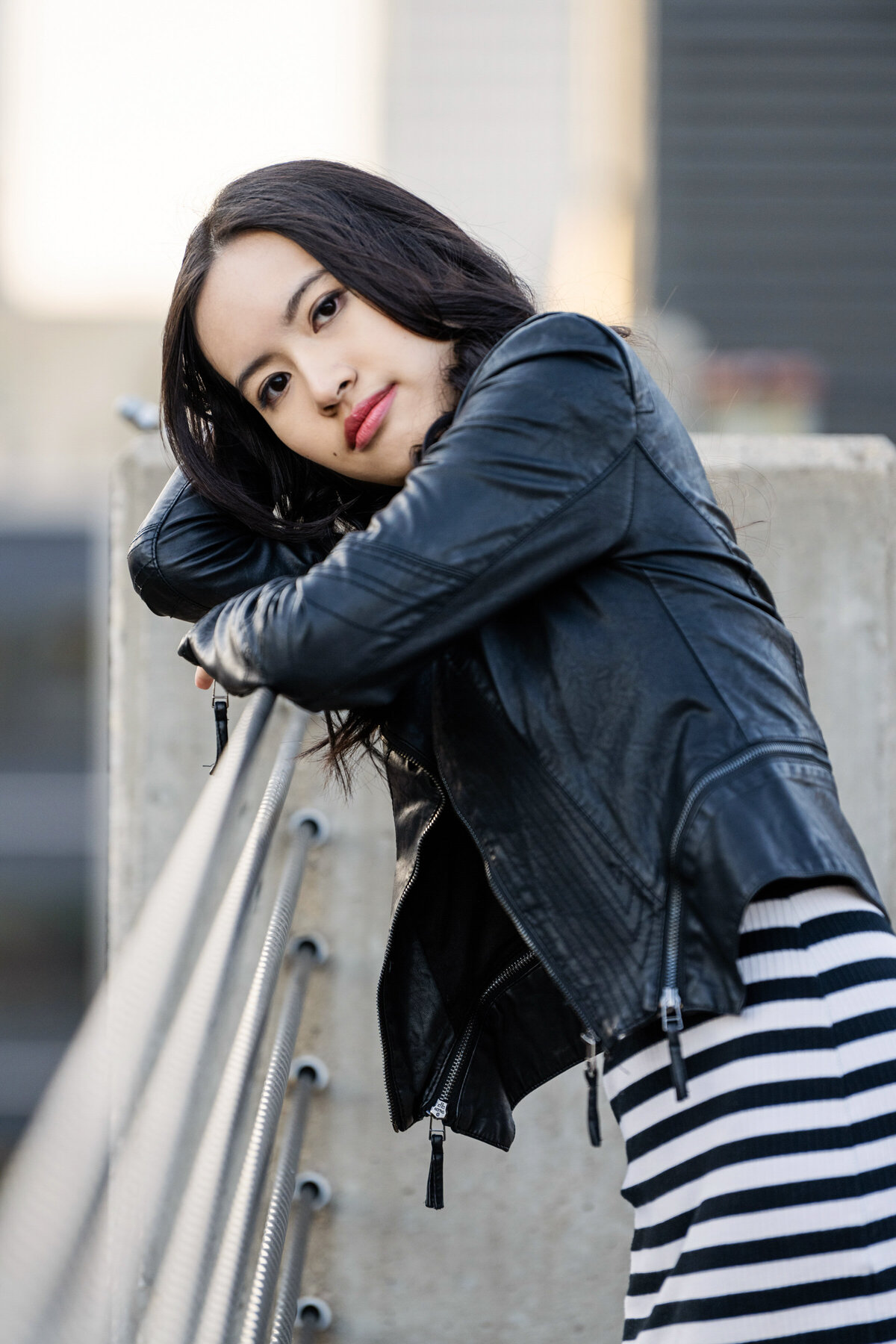 Maple Grove Minnesota senior photo of girl leaning against a railing in the city