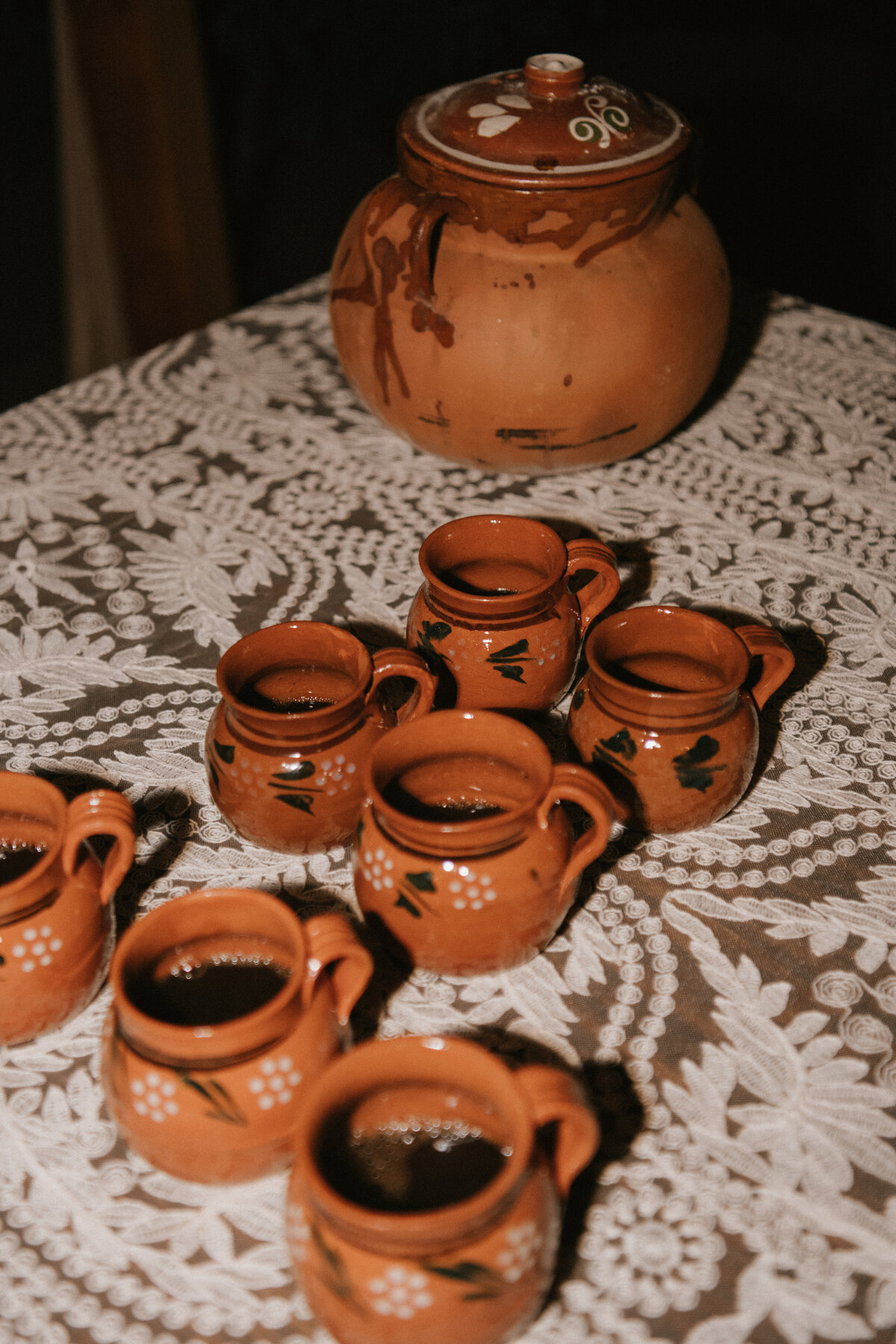 use of cultural mexican pottery for mexican hot chocolate during late night bites at high end destination wedding.