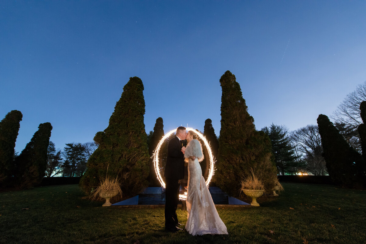 night shot of bride and groom kissing outside from wedding at The Carltun