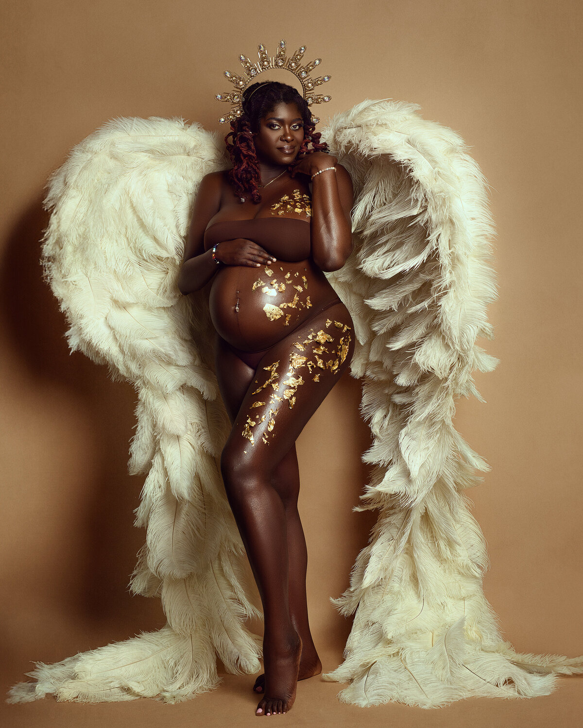 Maternity boudoir glam session with wings