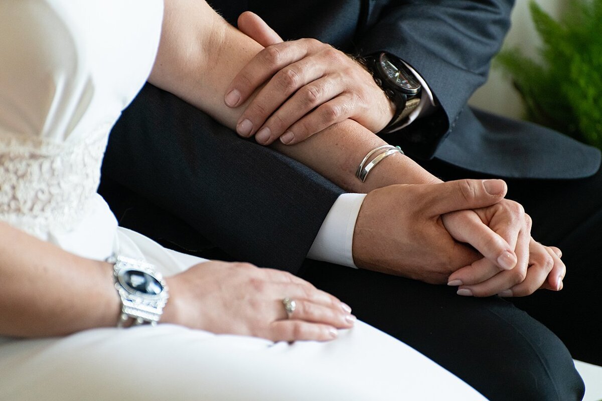 Close-up of Bride and Groom holding hands during self-uniting Quaker wedding ceremony in Pittsburgh, PA