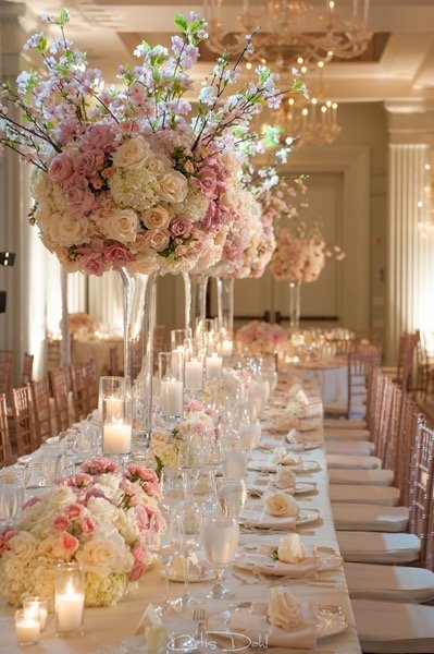 pink and white reception  table setup