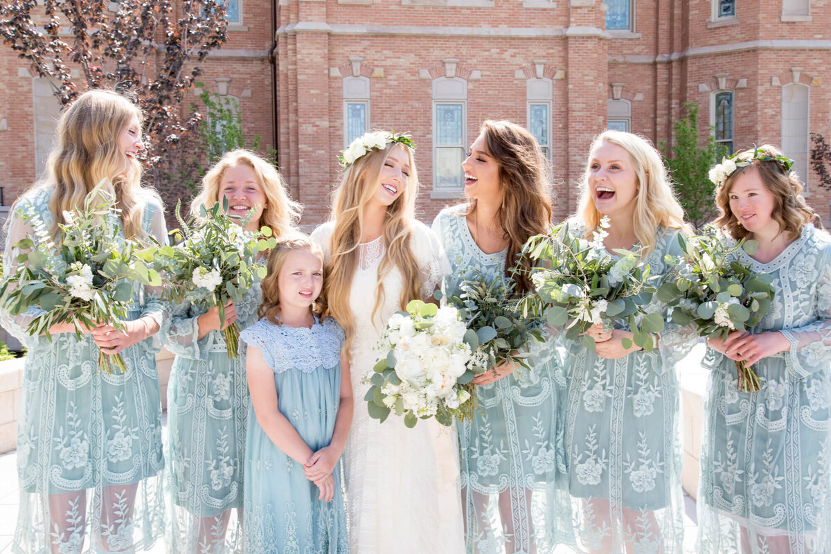 a bride laughing with her bridesmaids . wedding photography created by jessica Bowles