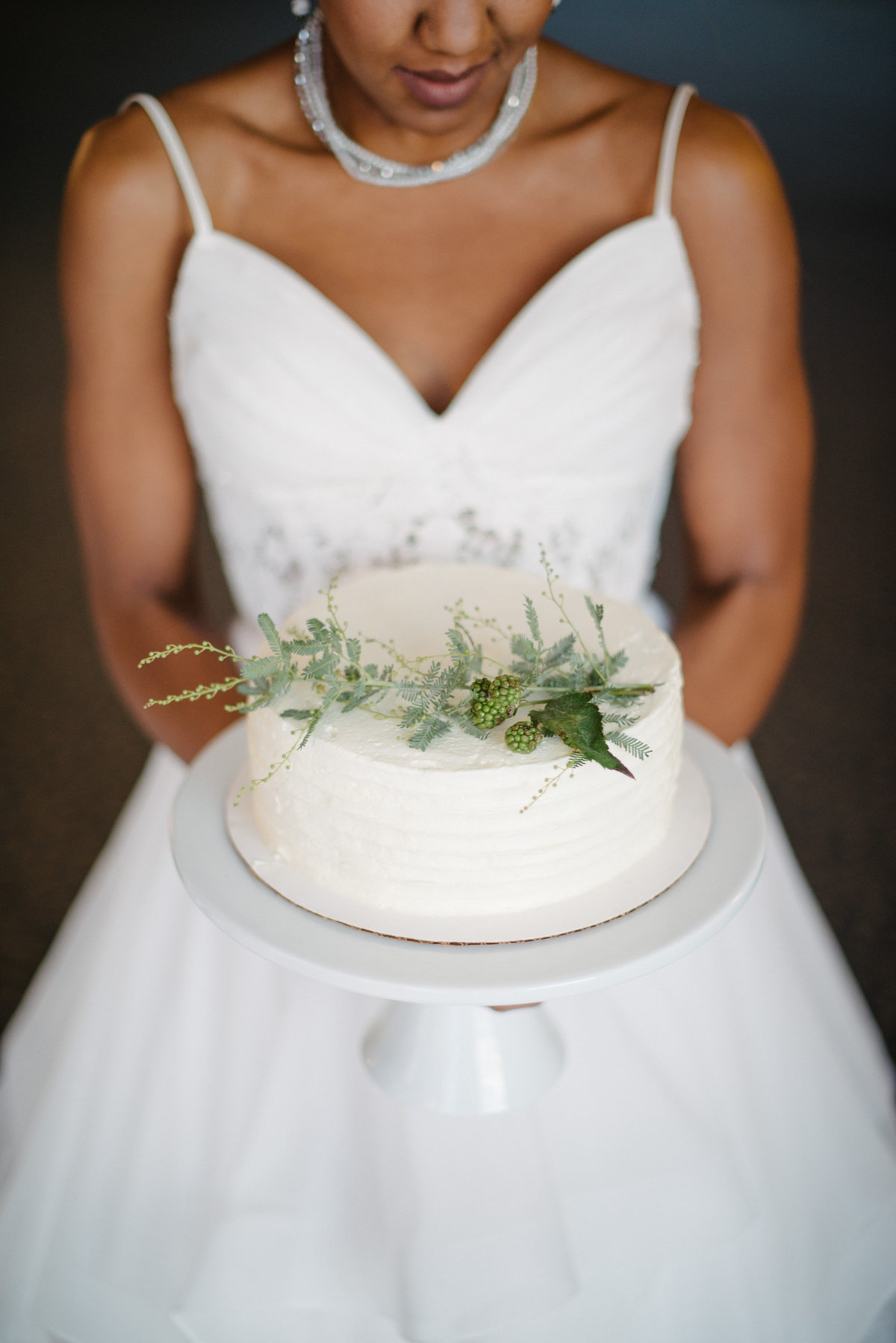 bride with cake at Edgewater Hotel