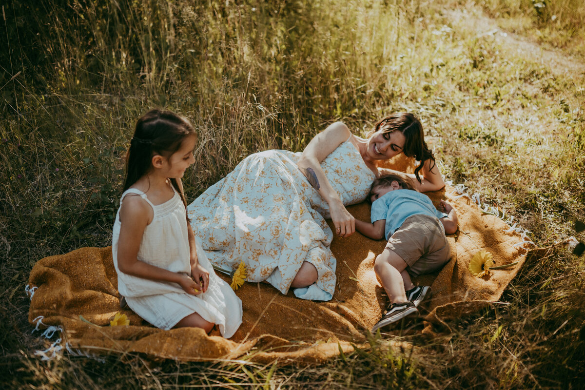 mom, dad and baby at the park with their dogs during session with Oregon photographer