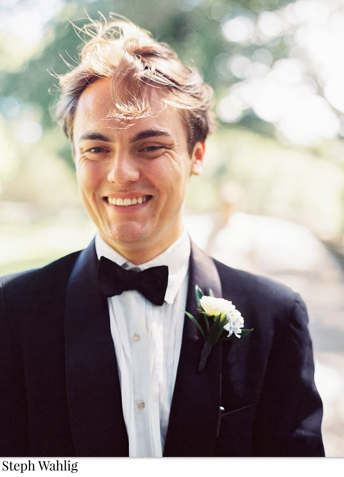 white tea roses, small boutonniere, black tux, bowtie  