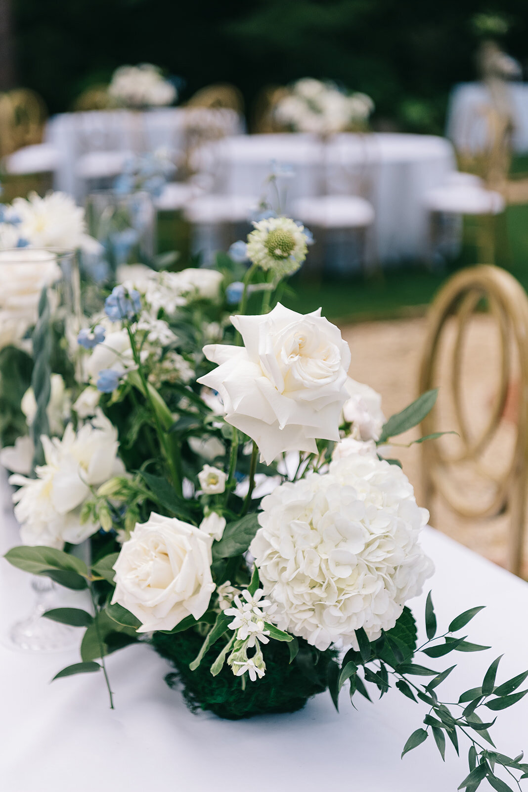 White and blue floral centerpieces designed by Abby Grace Florals at Greenville SC wedding