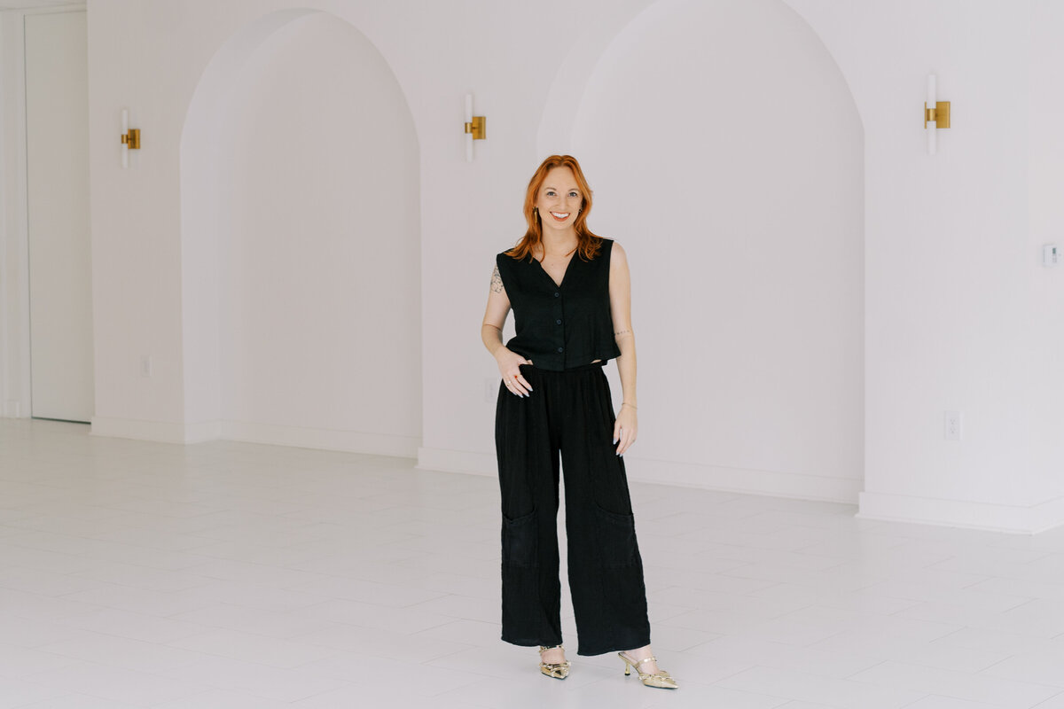 model posing in front of arches