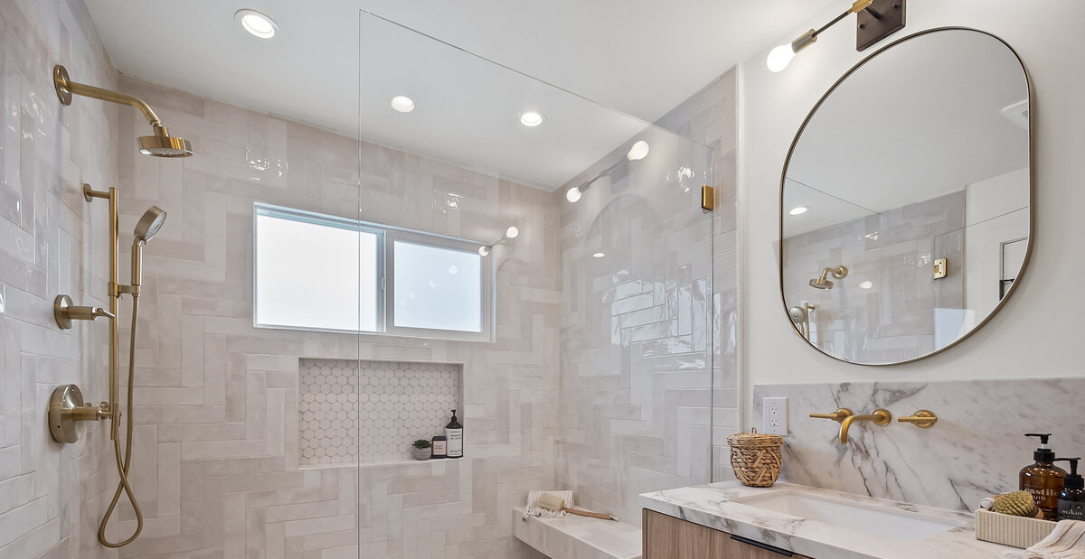 Bathroom remodel white marble sink and neutral tile walls