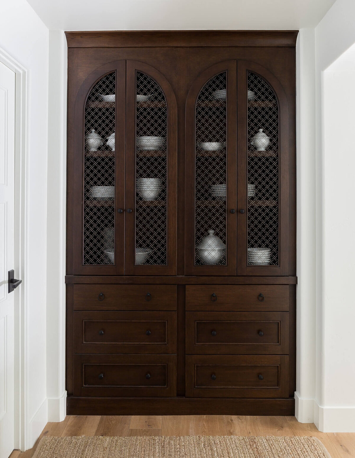 built-in-cabinet-dark-wood-metal-grille-doors