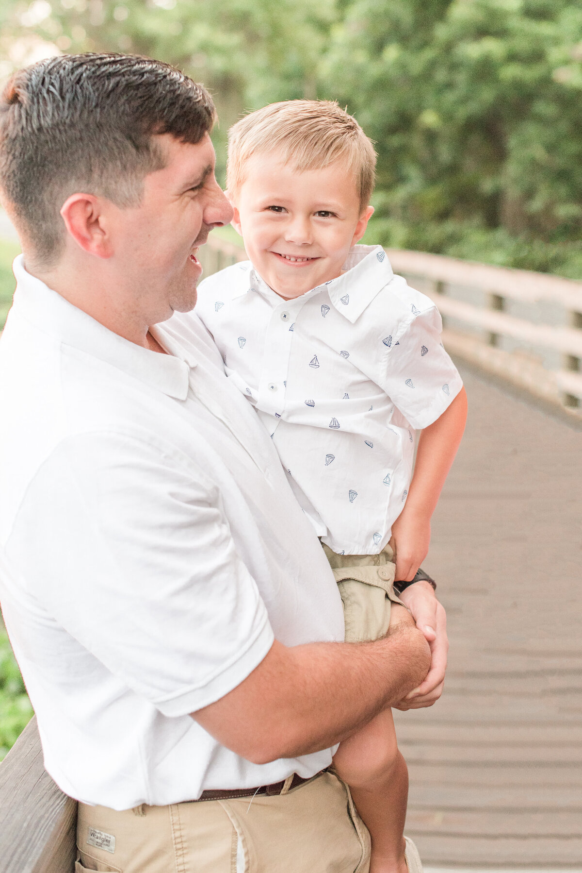 dad holding son in his arms