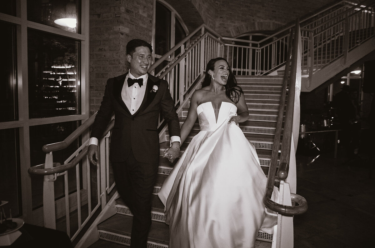 bride and groom enter wedding reception