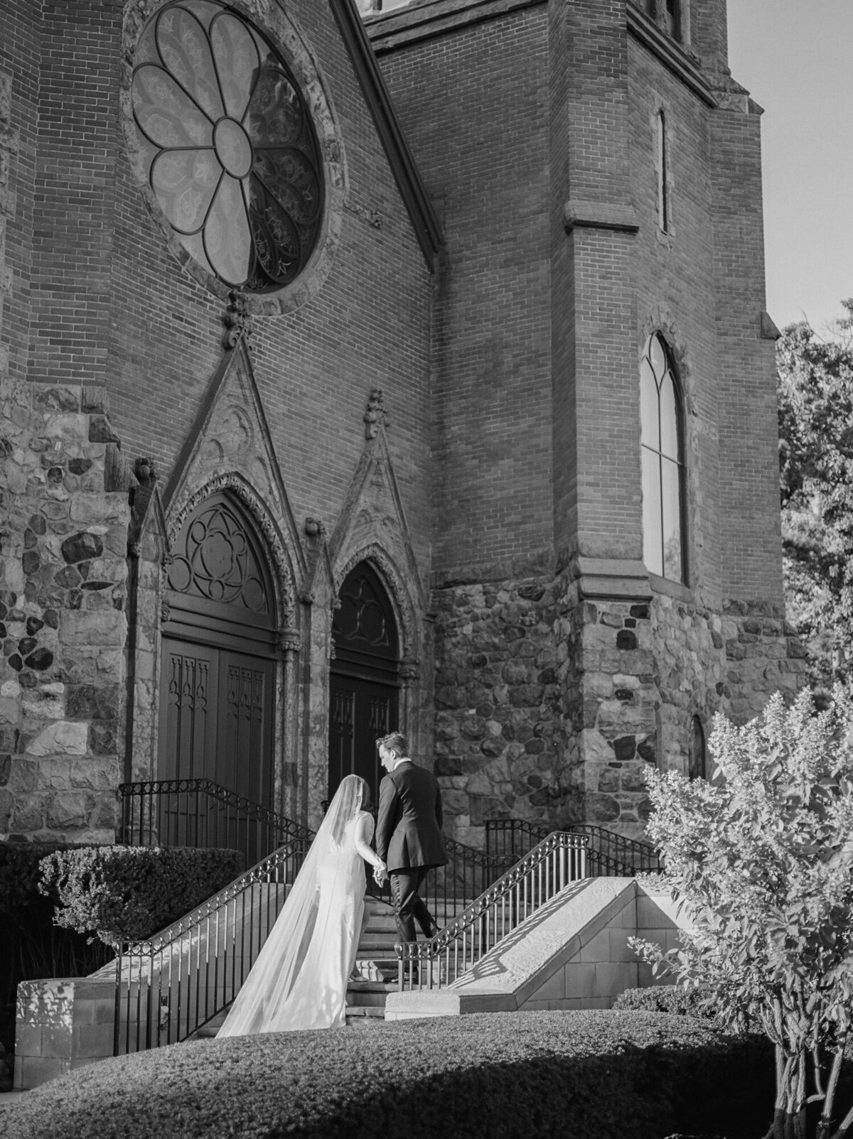 couple outside ornate historic cathedral wedding venue in Detroit, Michigan