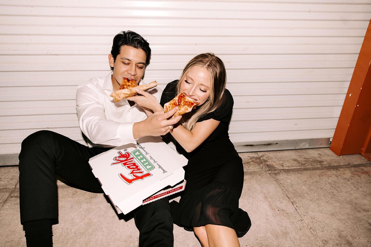 engaged-couple-eating-pizza