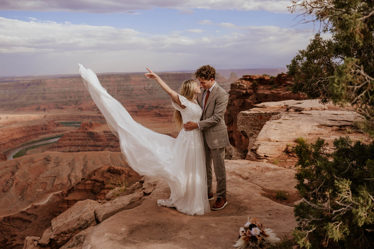 Elopement photo of bride and groom kissing  in the dessert