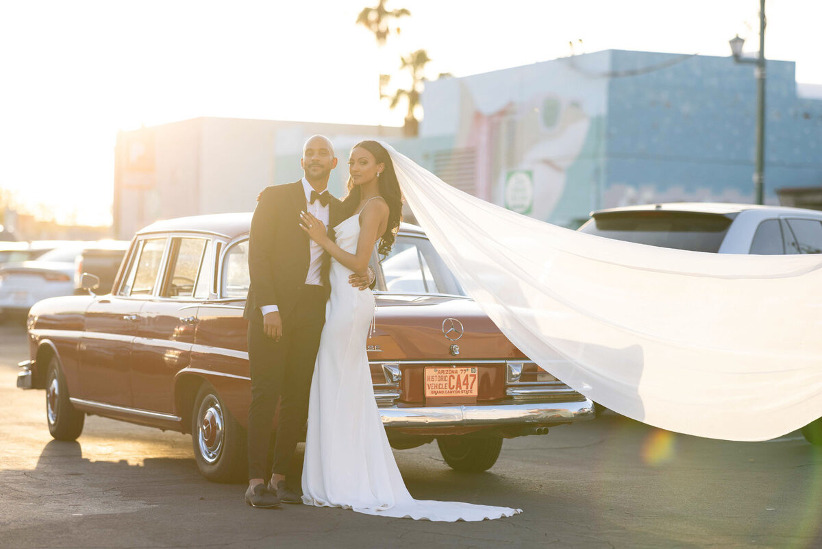 Classic car photo with bride & groom.