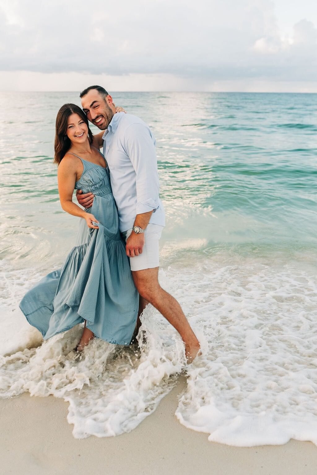 couple in waves on Pensacola beach