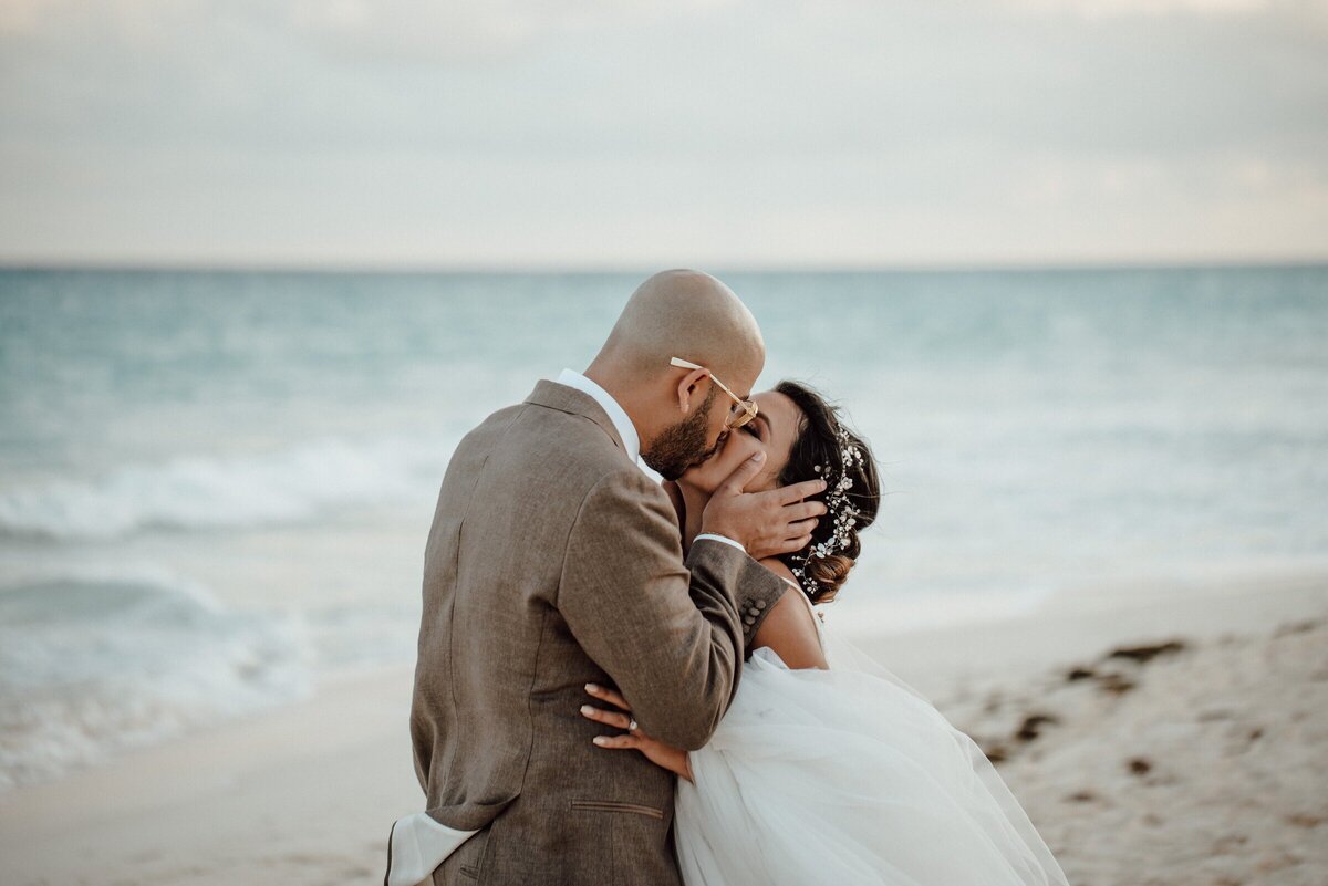 Couple kissing at their destination wedding planned by a travel agent at CC travels