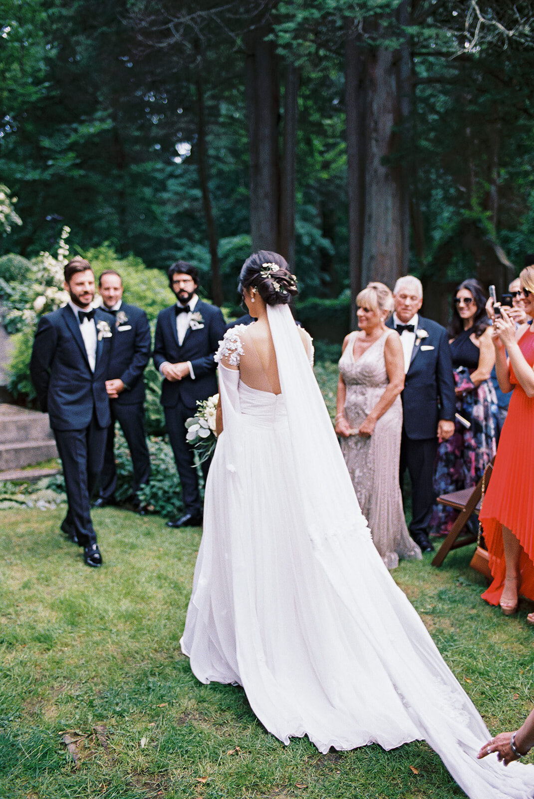 Bride walking down the aisle during a destination wedding ceremony