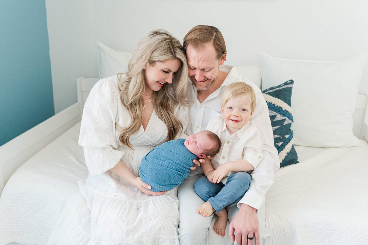 Light and neutral baby boy in home lifestyle newborn photos colorado elena spraguer photography 0024