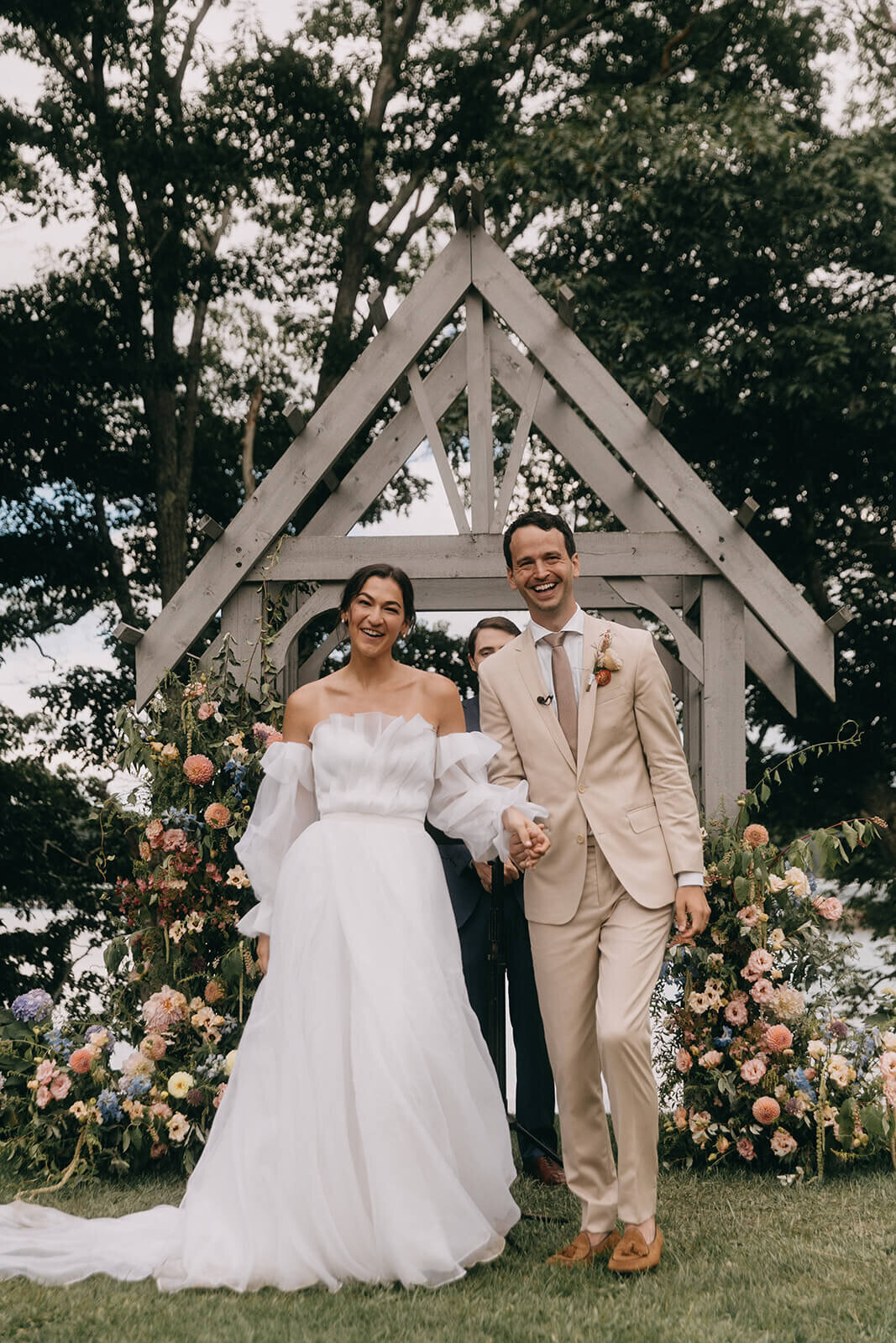 31wedding-ceremony-floral-arch-pink-orange-greenery