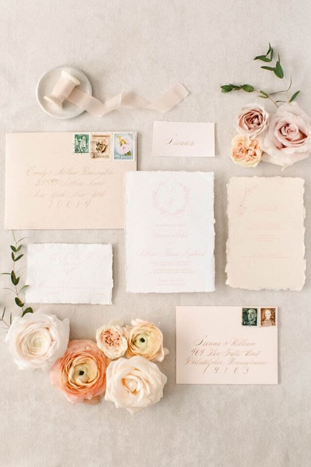 Beautiful wedding invitation paper suite featuring pinks, peach, and white roses, styled by CNC Event Design, modern and elegant wedding planner based in Calgary, Alberta. Featured on the Brontë Bride Vendor Guide.