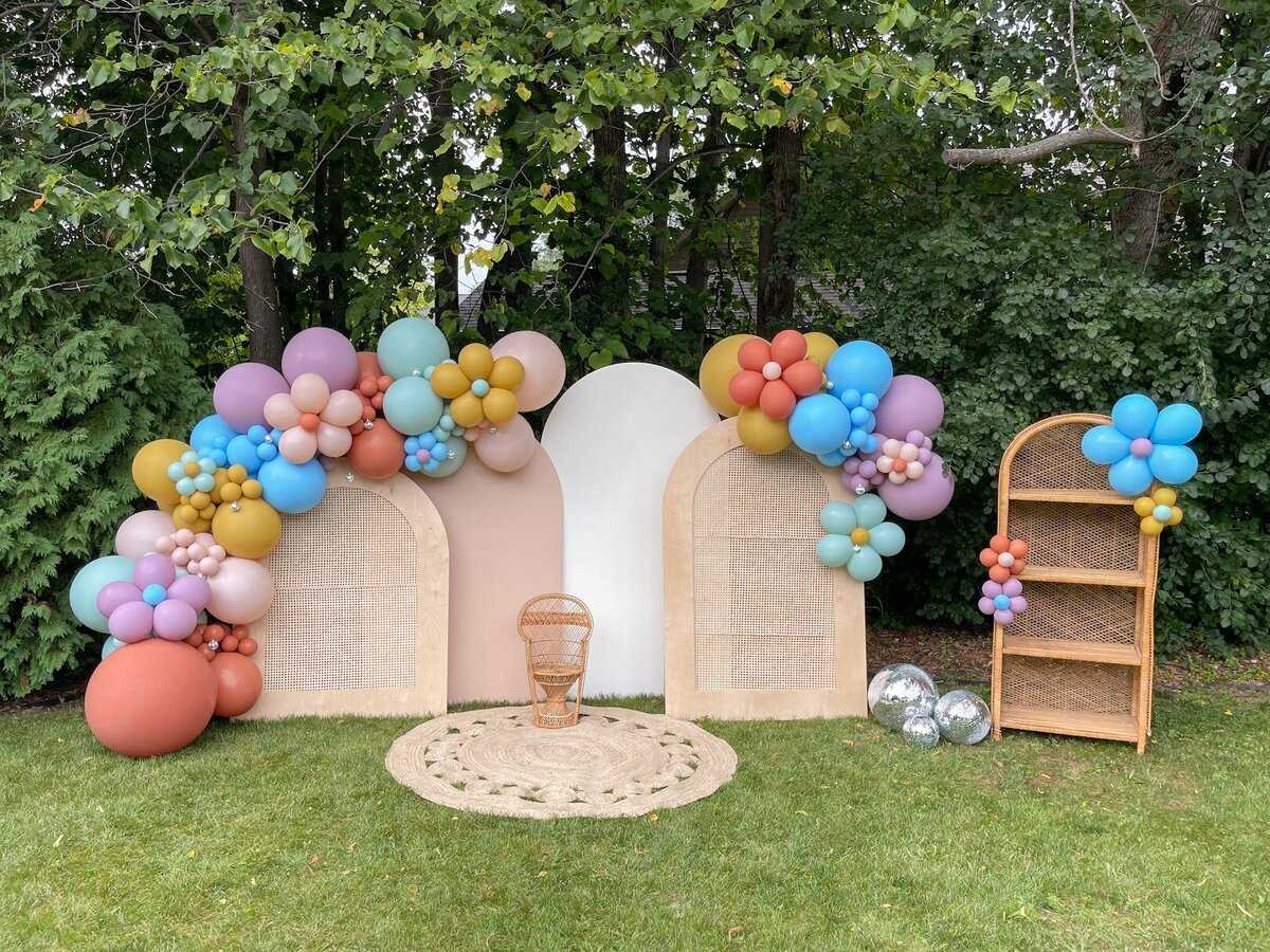 Bright balloons attached to wooden backdrops