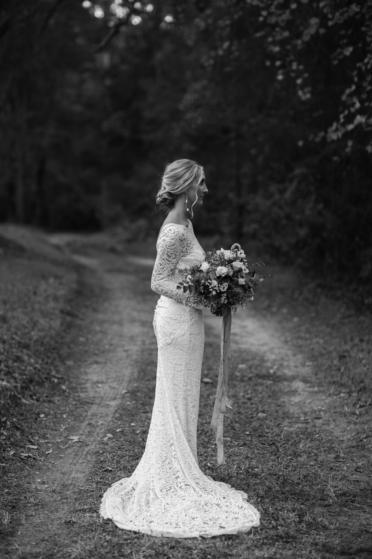 Bridal portrait on a tree lined path