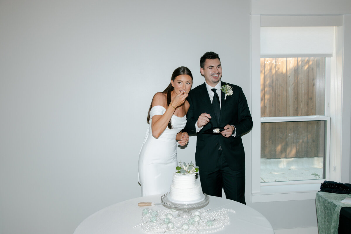 bride and groom with cake