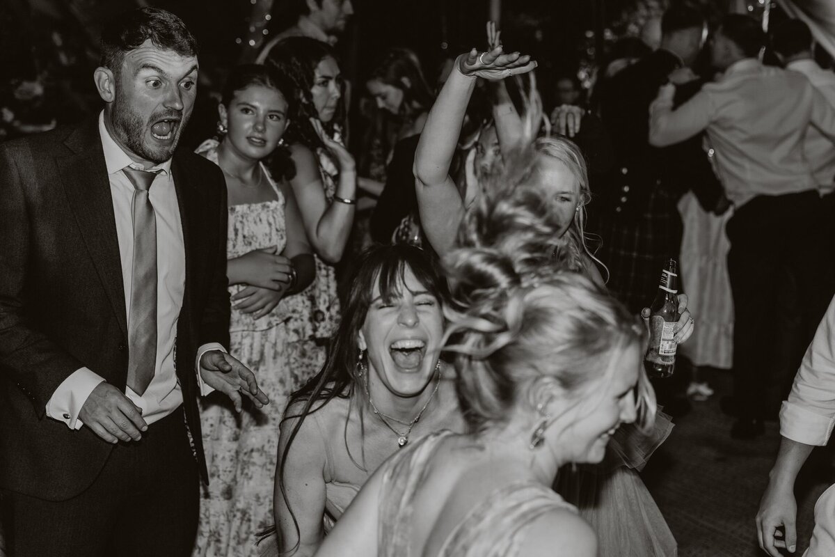 Nightime fun on the dancefloor of a manorbier castle wedding