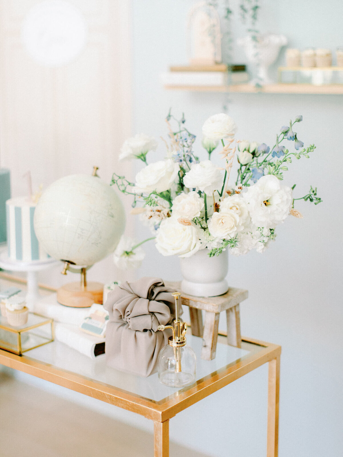 detailed photo of flowers and globe decor for isaiah's first birthday
